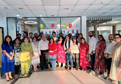 Lex Visas team celebrating Holi 2026 with colors, smiles, and festive moments at the workplace