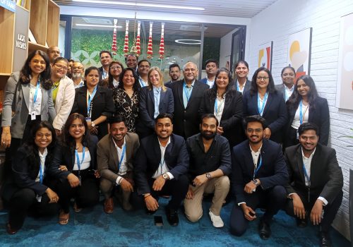 Team Lex Visas Unplugged event featuring employees enjoying fun activities, music, and team bonding moments